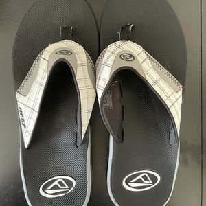Reef flip flops with bottle opener on bottom